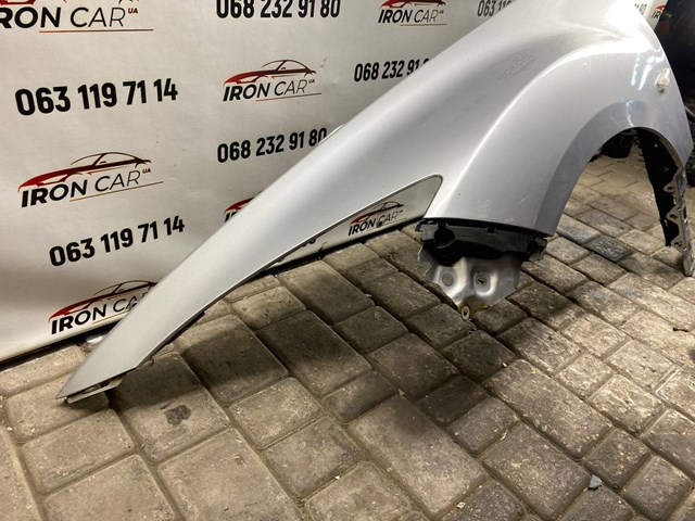 Крыло левое Mazda GSYD52210