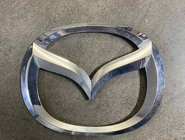 Compre Emblema de tampa de porta-malas (emblema de firma) Mazda CX-7 