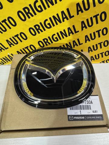 Эмблема решетки радиатора BCKB51730A Mazda