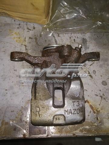 Купить KAY02671XA Mazda Суппорт задний левый