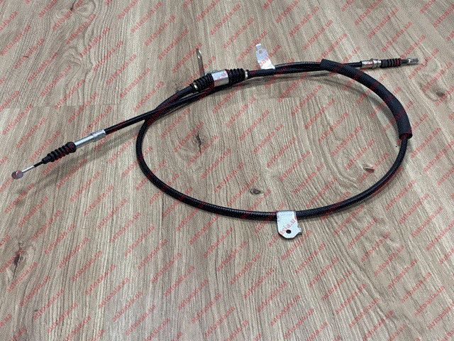 Трос ручника 1064001076 Geely