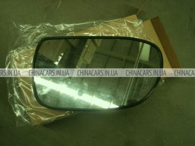 Стекло левого зеркала заднего вида 1068003399 Geely