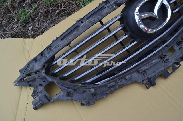 Фирменный значек решетки радиатора Mazda G46M50716