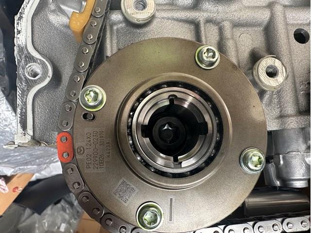 Купить PE02124X0 Mazda Шестерня впускного распредвала