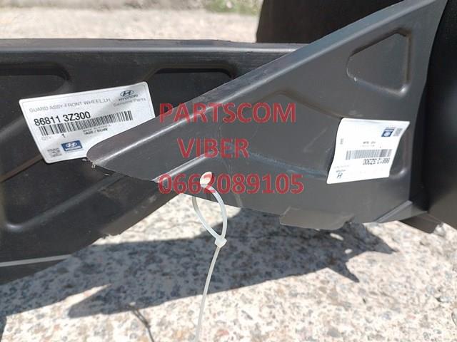 868123Z300 Hyundai/Kia guarda-barras direito do pára-lama dianteiro