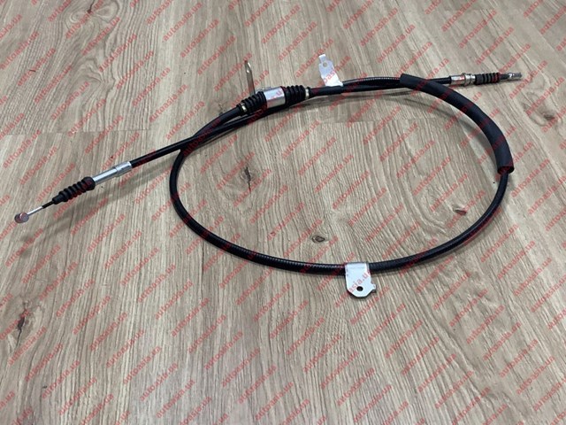 Трос ручника задний Geely 1064001076